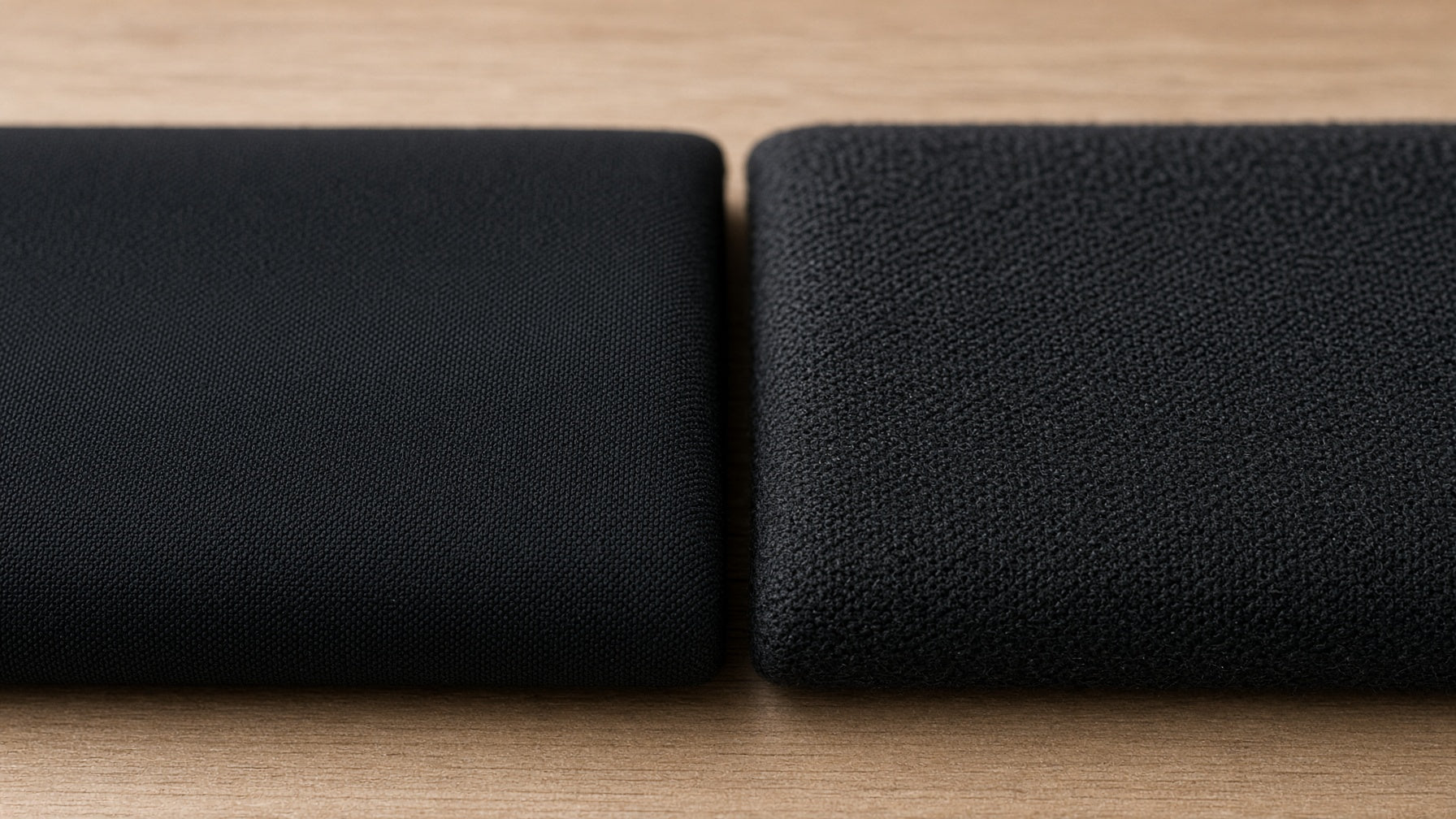 Two folded Oakman fabric swatches side by side, contrasting weave textures.