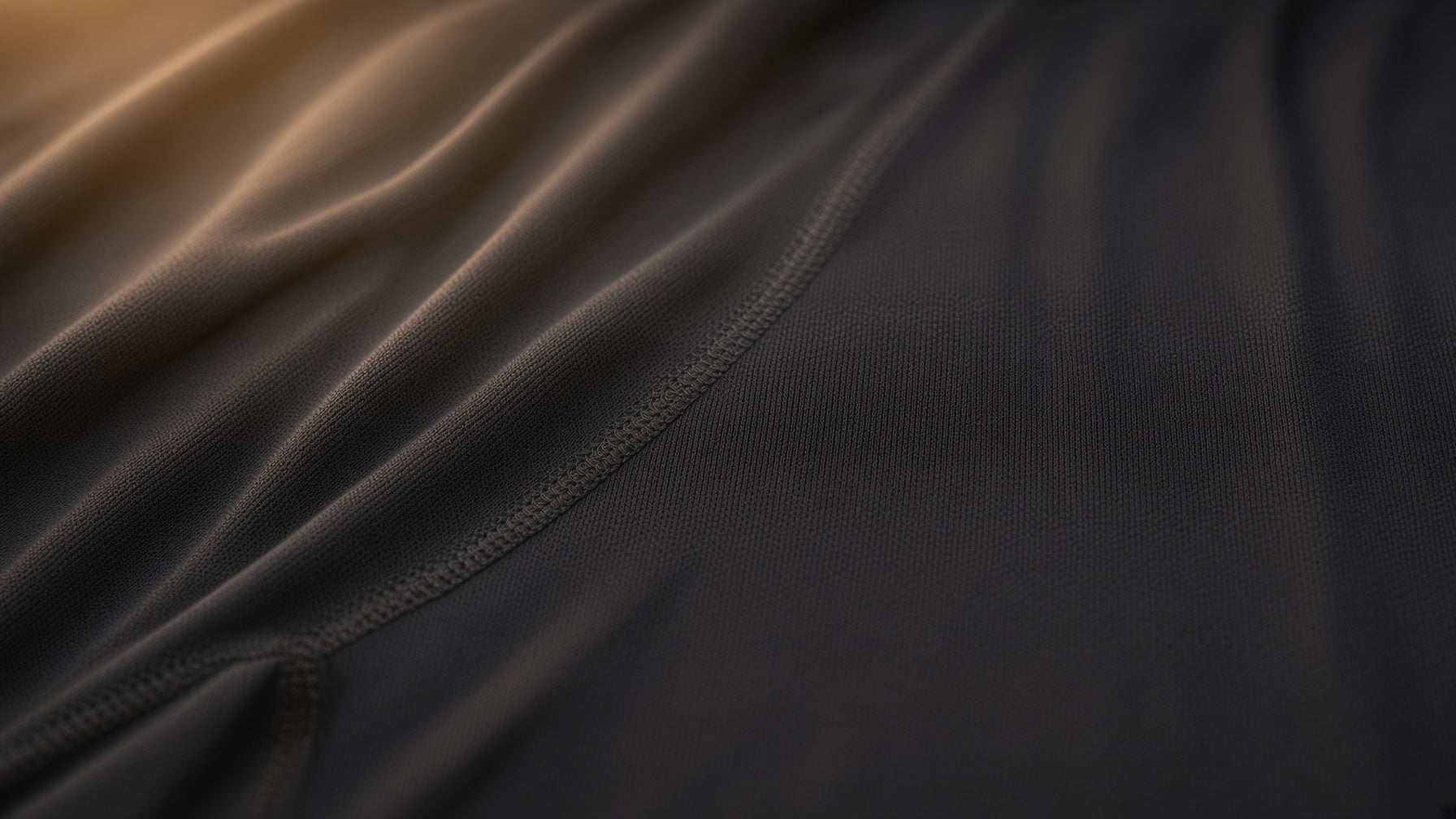 Folded Oakman fabric in close-up with a diagonal seam visible.